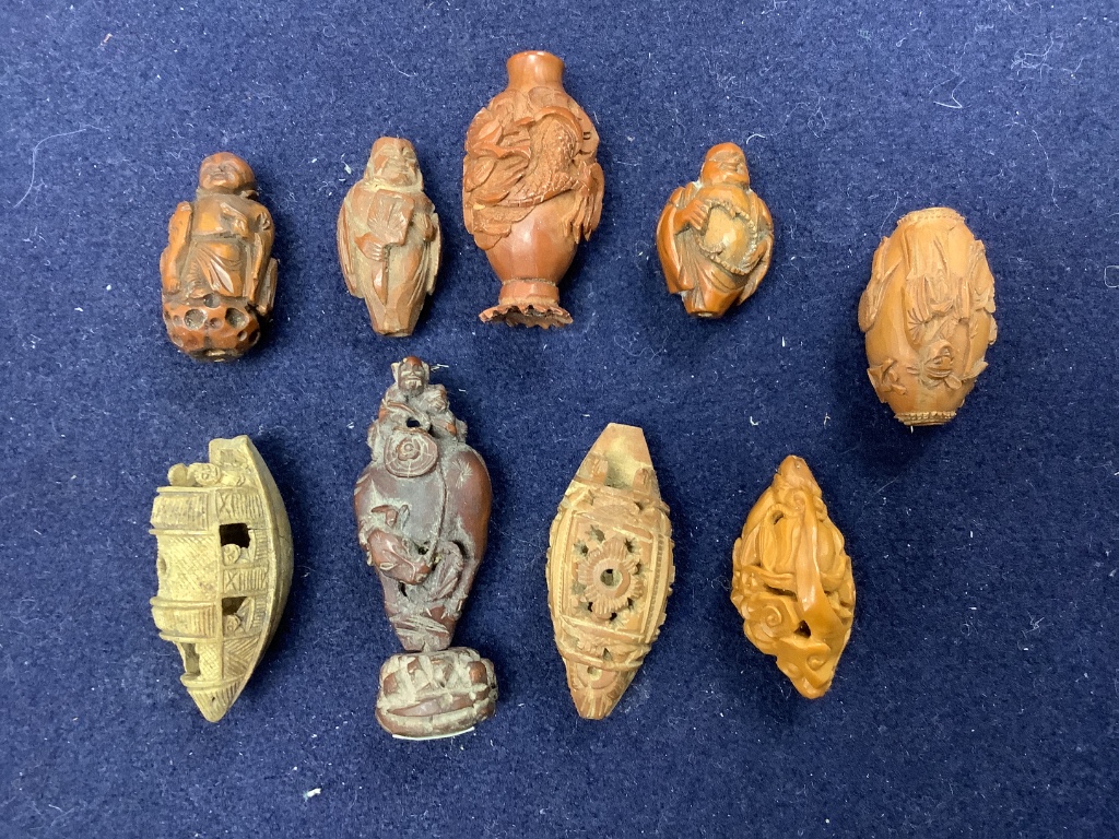A group of Chinese peach stone carvings